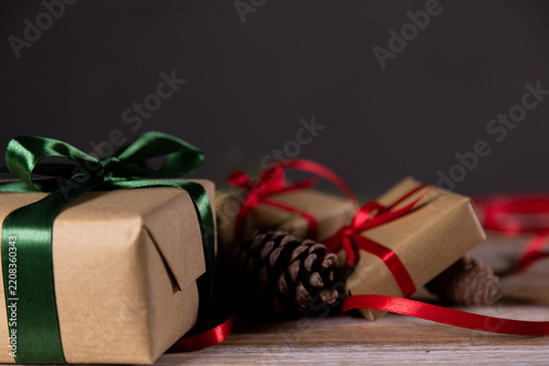 Christmas presents and other small gifts on a wooden base