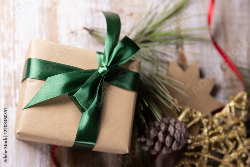 Christmas presents and other small gifts on a wooden base