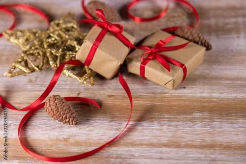 Christmas presents and other small gifts on a wooden base