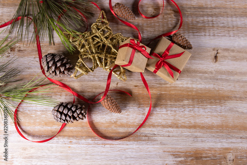 Christmas presents and other small gifts on a wooden base