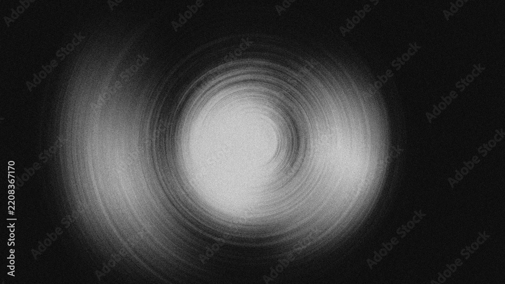 Fototapeta premium A striking monochrome abstract illustration featuring a hypnotic spiral shape. The grainy black-and-white texture with a dynamic spin blur effect makes it perfect as a modern digital wallpaper.