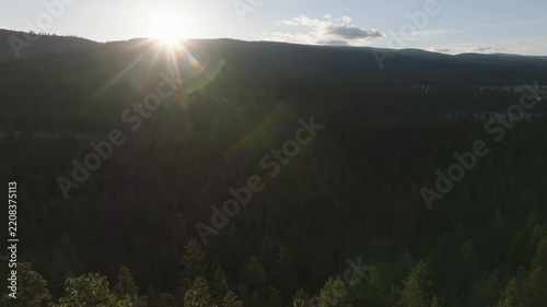 Aerial sunrise over forested mountains in Montana