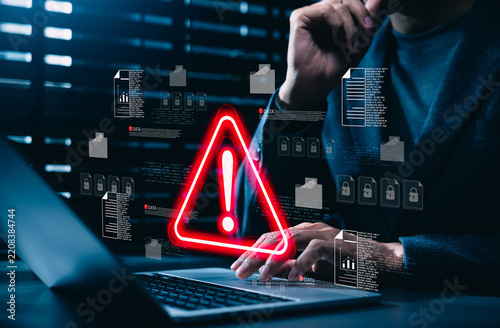 Data security warning and cyber risk alert concept. Person using laptop with digital files, lock icon, red warning symbol. data breach, document protection, threat detection, secure incident response