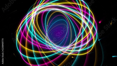 Neon abstract orbiting rings motion background, glowing colorful light trails, futuristic digital energy tunnel, science fiction particle flow