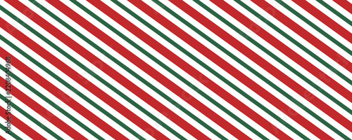 Christmas seamless pattern with a classic candy cane design with alternating red and green diagonal stripes on a white background, perfect for festive holiday themes.