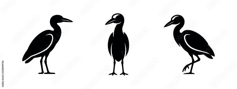 Obraz premium Three black silhouettes of herons or storks