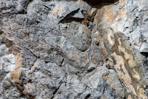 Gaspesie, Quebec, 02 September 2026 : Close up view of a rugged fractured rock face showing natural geological weathering and mineral textures