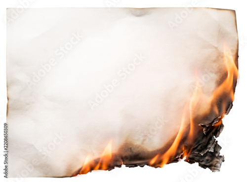 Obraz na plátně Burning paper with flickering flames isolated on a white background demonstratin