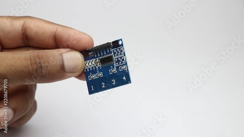 Capacitor touch sensor module commonly used in prototyping electronic projects held in the hand
