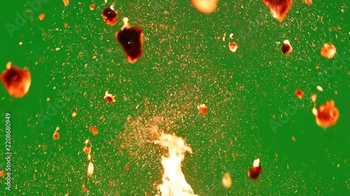 Glowing fire sparks and embers overlay. Isolated orange particles on green screen background. Realistic burning dust effect for design