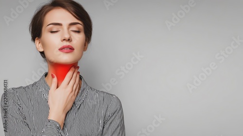 Woman feeling throat discomfort and pain.