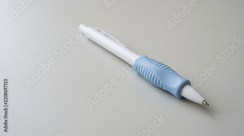 Ergonomic silicone pen grip enhancer on a clean technical surface