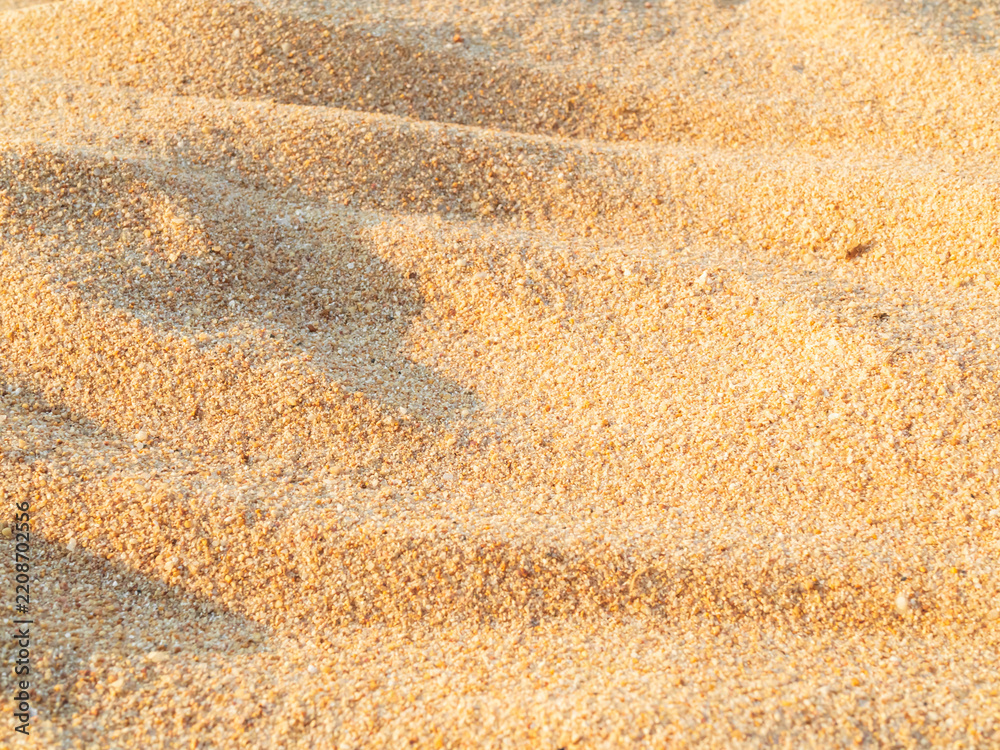 Fototapeta premium Sand nature travel background, beach close up texture summer desert zen garden coast ocean for vacation, hot tropical scene nature, holiday dune pile dry brown heap
