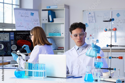 Scientific research and medical innovation, young scientists working in a lab...