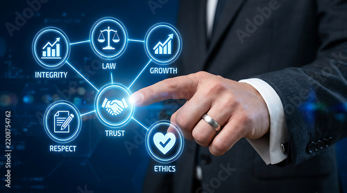 Businessman touching glowing blue digital interface with business ethics