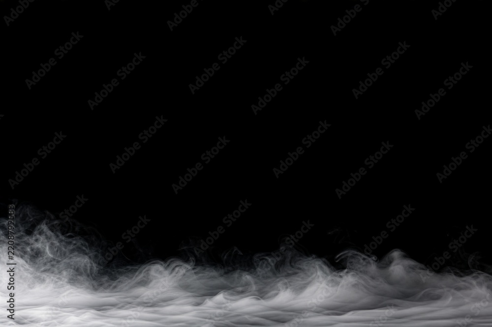 Fototapeta premium Low white fog along the bottom of a black background for cinematic product and luxury advertising.