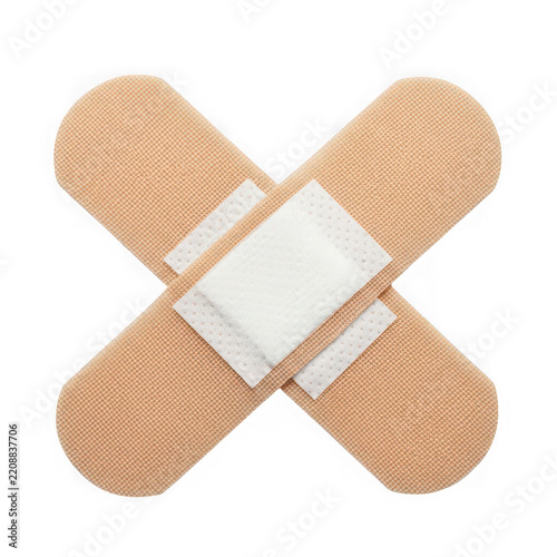 Adhesive fabric bandage cross patch isolated on transparent background for medical concepts
