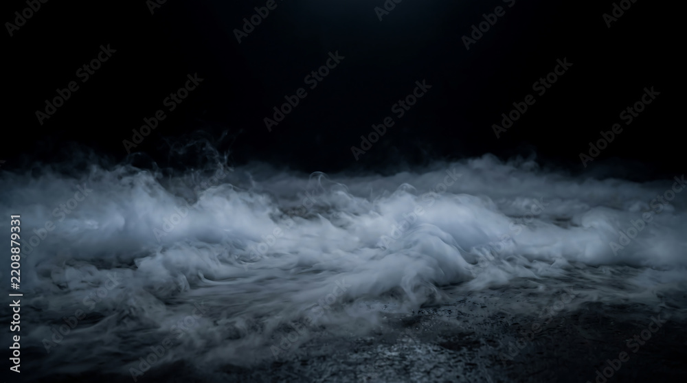 Obraz premium Low lying white fog creeping across a dark textured ground