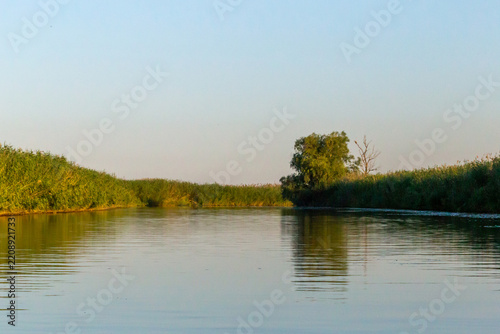 Russia. Astrakhan region. Volga River Delta. A river channel on a windless summer evening