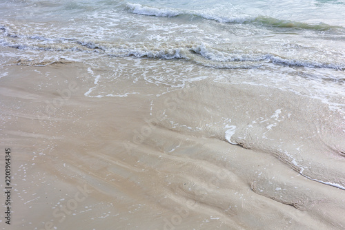 Gentle Waves Breaking on Wet Sand and Creating White Foam at Moonta Bay, South Australia, Australia