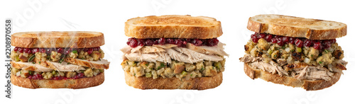 Delicious thanksgiving leftover sandwiches featuring sliced roasted turkey breast herb stuffing and tart cranberry sauce served on toasted sourdough bread isolated on transparent background