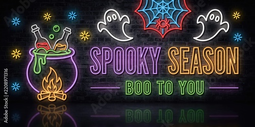 Spooky season neon sign with cauldron, ghosts, and spider web on brick wall