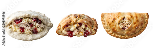 Baked savory turkey pastry pockets filled with melted cheese and fresh cranberry sauce featuring golden crusts captured from a high angle view on transparent background