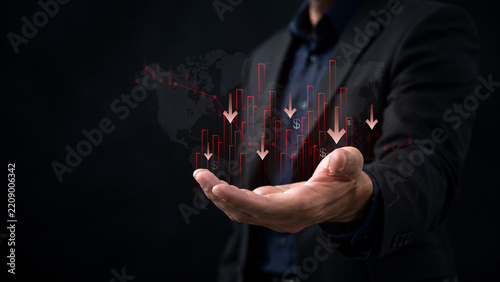 financial market downturn and global economic crisis. businessman holding falling red stock charts, symbolizing crisis, investment loss, inflation impact, and bearish trend across world economy