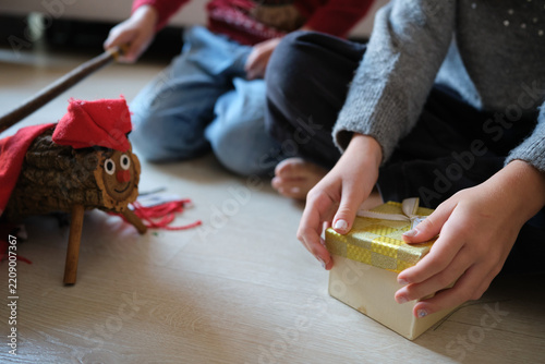 Children celebrating catalan tió de nadal tradition