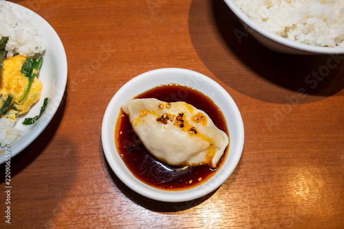 Steamed Dumpling Served With Dark Dipping Sauce