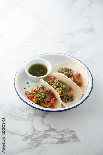 Beef taco with vegetables and corn