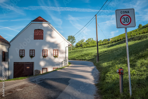 Natural landscape of old house on green hills.