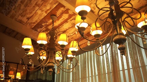 Vintage iron hanging chandelier with wooden interior, India