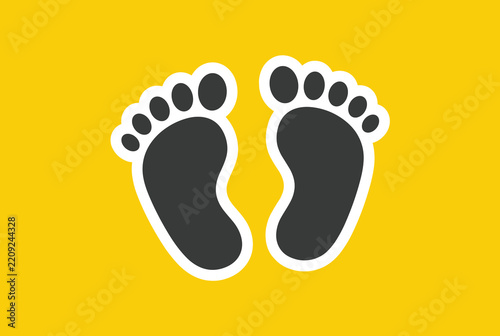 Black bare footprints with white outlines centered on vibrant yellow background showing walking theme