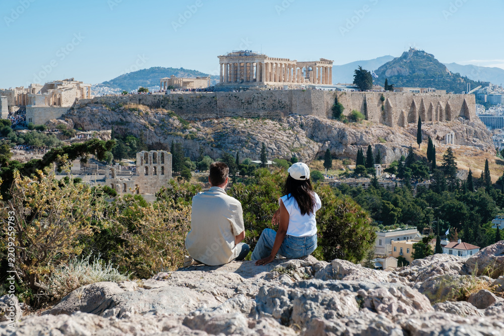 Fototapeta premium Couple enjoying breathtaking views of the Acropolis in Athens, Greece