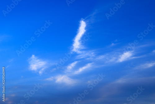Blue sky with soft white clouds on clear day