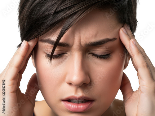 Woman holding her head with a concerned and stressed expression