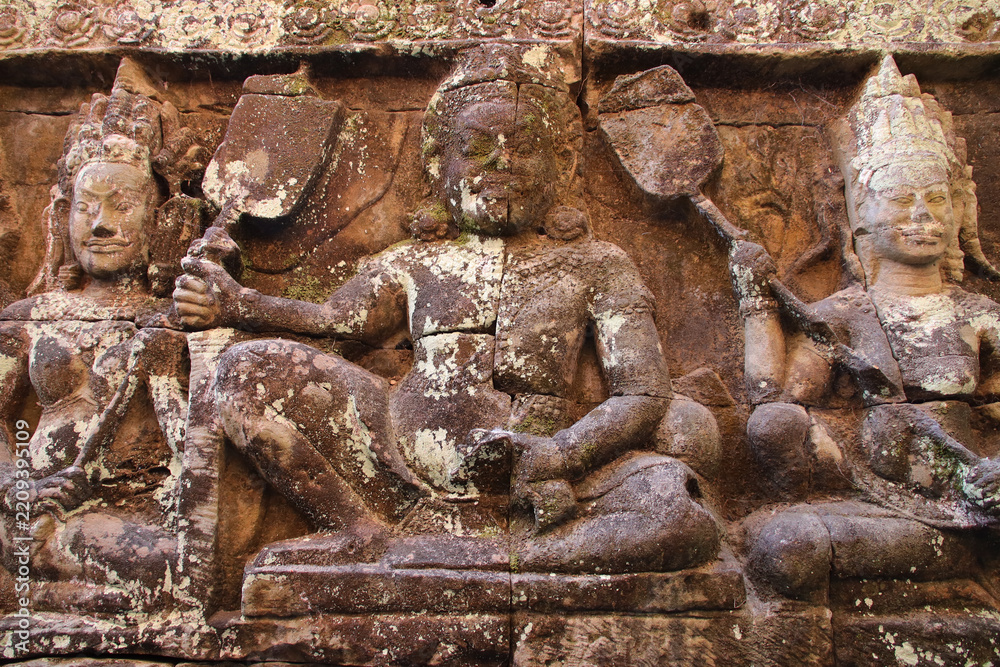 Fototapeta premium sculpted terrace in a ruined khmer hindu and buddhist complex (angkor thom) in angkor in siem reap in cambodia 