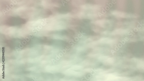 Abstract ethereal light beams shining through soft hazy clouds