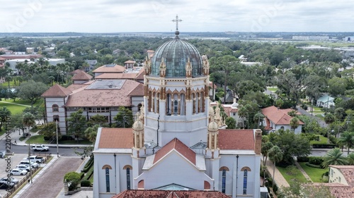 Aerial view of Memorial Presbyterian Church with its distinctive dome and terracotta roof tiles, surrounded by the historic urban landscape of St. Augustine, Florida, United States.