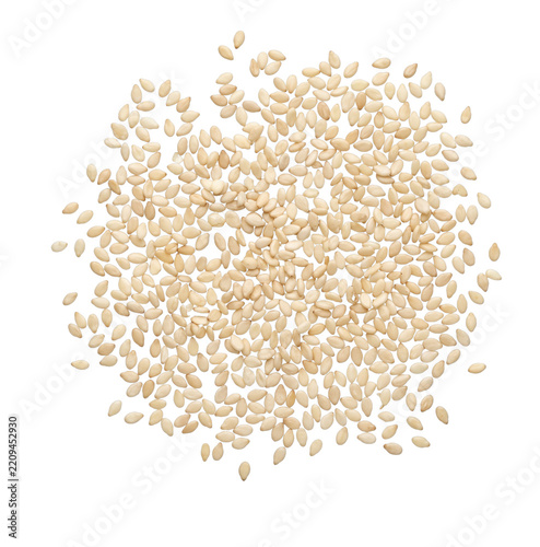 A scattered pile of raw white sesame seeds isolated on a clean white background for cooking