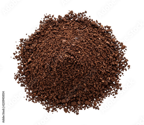 Obraz na plátně A heap of dark roasted ground coffee beans isolated on a clean white background