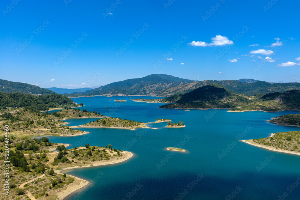 Fototapeta premium Panoramic Aerial View of Artificial Lake Aoos Surrounded by the Pindus Mountains