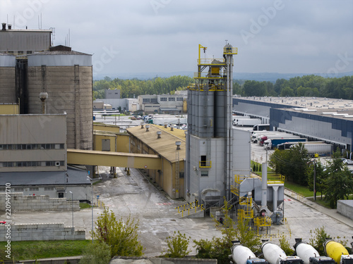 Aerial view of the bituminous mass factory with industrial silos, concrete mixing trucks, and warehouses in Krakow, Lesser Poland Voivode, Poland.