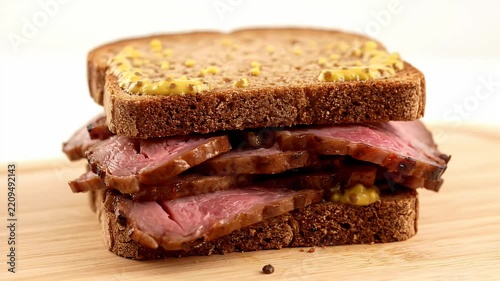 Thick Cut Roast Beef Sandwich With Mustard On Rye Bread