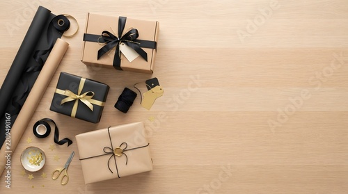 Festive gift wrapping supplies with beautifully presented presents on a neutral background