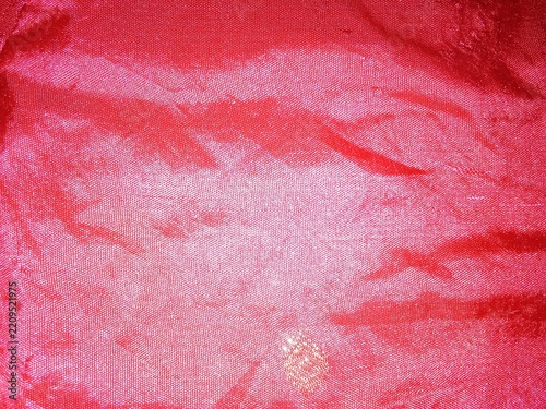 Close up view of red textile fabric showing detailed woven texture with woven material cloth pattern fabric background material surface knitted fabric bright red clothing