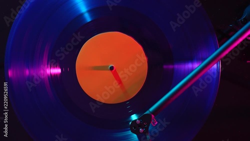 Close-up of a vinyl record playing on a turntable