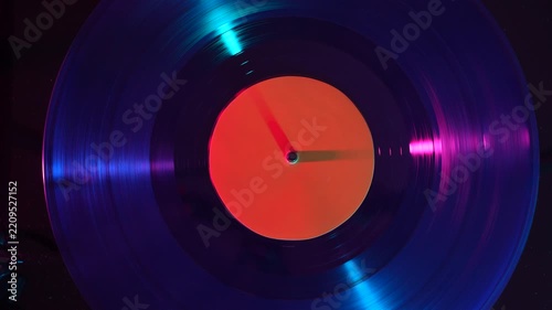 Spinning vinyl record with orange label