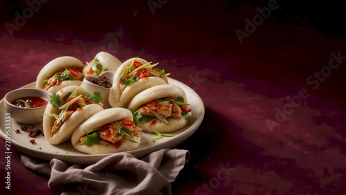 Steamed Bao Buns with Colorful Savory Filling on Dark Table, AI Generated